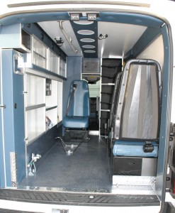 ford transit rear view with doors open and ambulance insde